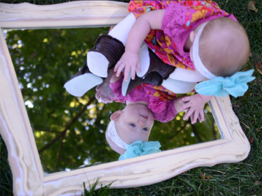 During a photo shoot, I threw the mirror on the ground and just let the babe crawl all over it.